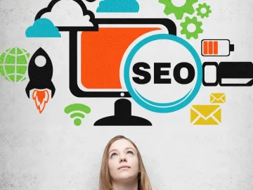 Graphic of a woman looking up at a screen with a computer and SEO in circle signifying local SEO